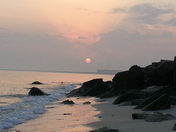 Scenic view of sea at sunset