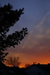 Silhouette of house at sunset