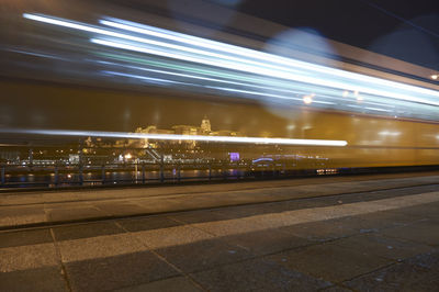 Light trails on illuminated city at night