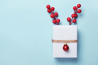 Close-up of cherries on table against white background