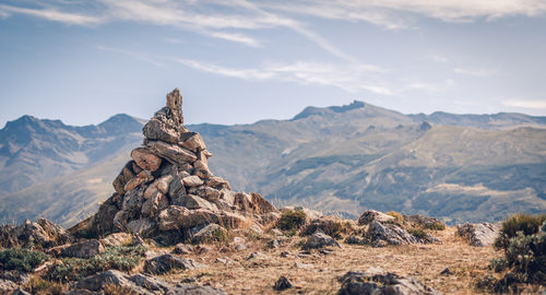 Rock formations on landscape against sky