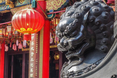 Statue of buddha outside temple building