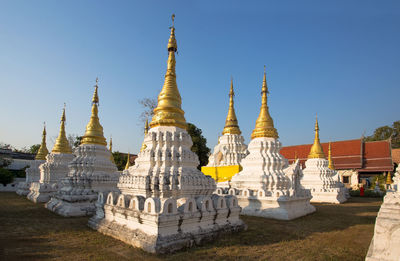 View of temple against building