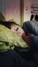 Close-up of young woman sleeping in bed