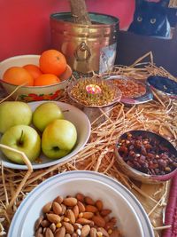 High angle view of fruits in basket on table