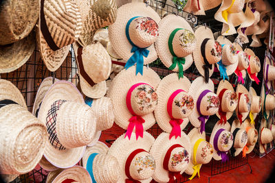 Full frame shot of multi colored hat hanging at market