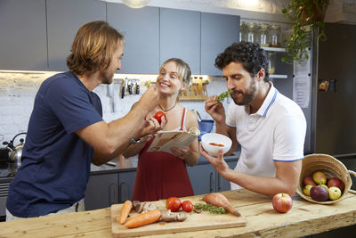 Portrait of senior man holding food at home