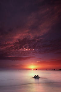 View of calm sea at sunset