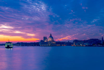 Basilica of santa maria della salute in venice seen at sunset with no one in the grand canale 