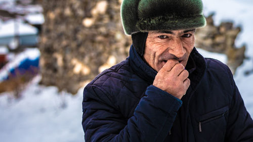 Portrait of man wearing hat during winter