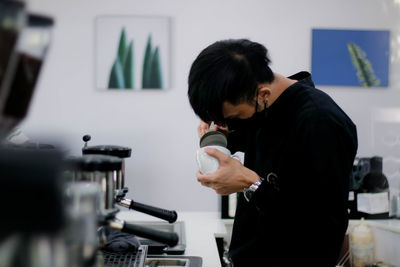 Woman holding coffee cup