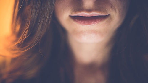 Close-up portrait of a smiling young woman