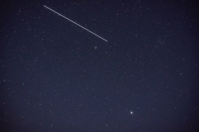 Low angle view of stars in sky at night