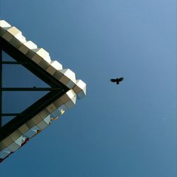 Low angle view of built structure against clear blue sky