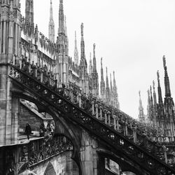 Low angle view of duomo di milano against sky