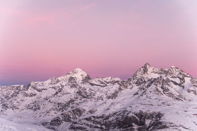 Scenic view of snow covered mountain against sky