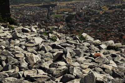 High angle view of rocks and buildings in city