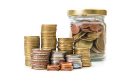 Stack of coins against white background