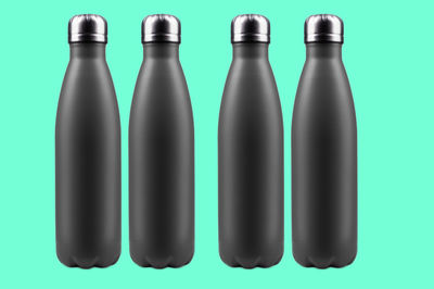 Close-up of bottles against blue background