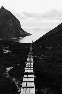 Scenic view of sea and mountains against sky