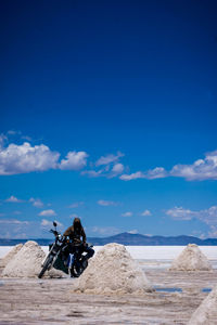 Scenic view of landscape against blue sky