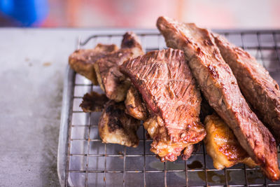 Close-up of meat on barbecue grill