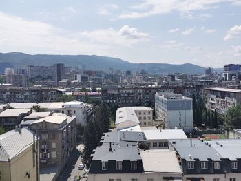 High angle view of buildings in city against sky