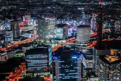 High angle view of illuminated buildings in city at night