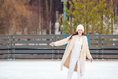 Rear view of woman standing in park