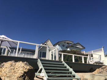 Low angle view of building against clear blue sky