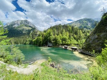 Scenic view of lake and mountains against sky