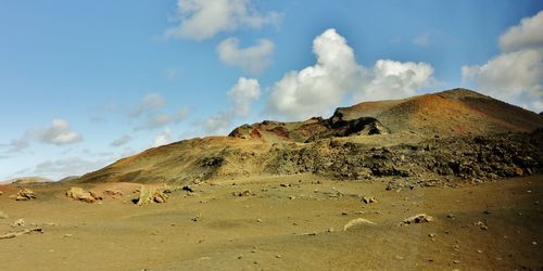 Panoramic view of volcanic landscape against sky