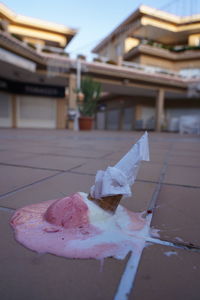 Close-up of ice cream against building