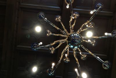 Low angle view of illuminated light bulb