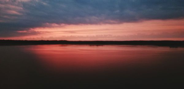 Scenic view of dramatic sky during sunset