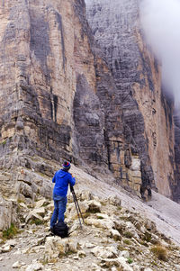 Man walking on rocky landscape