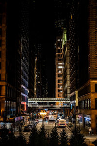 Illuminated buildings in city at night