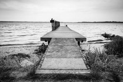 Pier over sea against sky