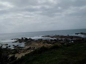 Scenic view of beach and sea against sky