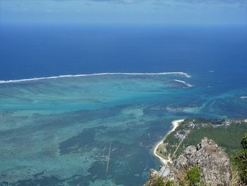 High angle view of sea shore against sky
