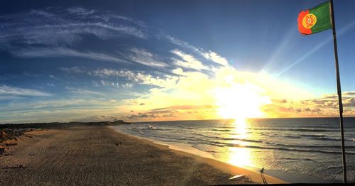 Scenic view of beach against sky during sunset