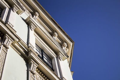 Low angle view of building against blue sky