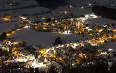 High angle view of illuminated city buildings during winter