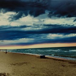 Scenic view of sea against cloudy sky