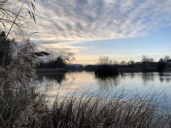 Scenic view of lake against sky during sunset