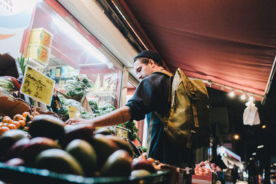 Low angle view of woman at market stall