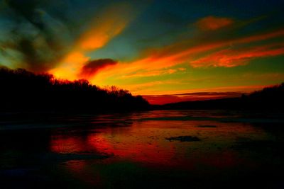 Scenic view of sunset over lake