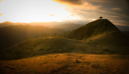 Scenic view of mountains against sky during sunset