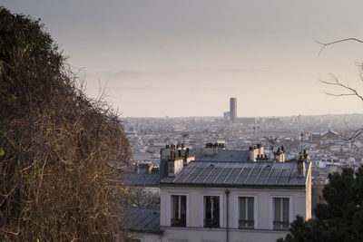 Buildings in city against sky