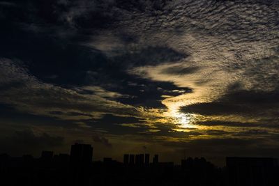 Silhouette trees against sky during sunset